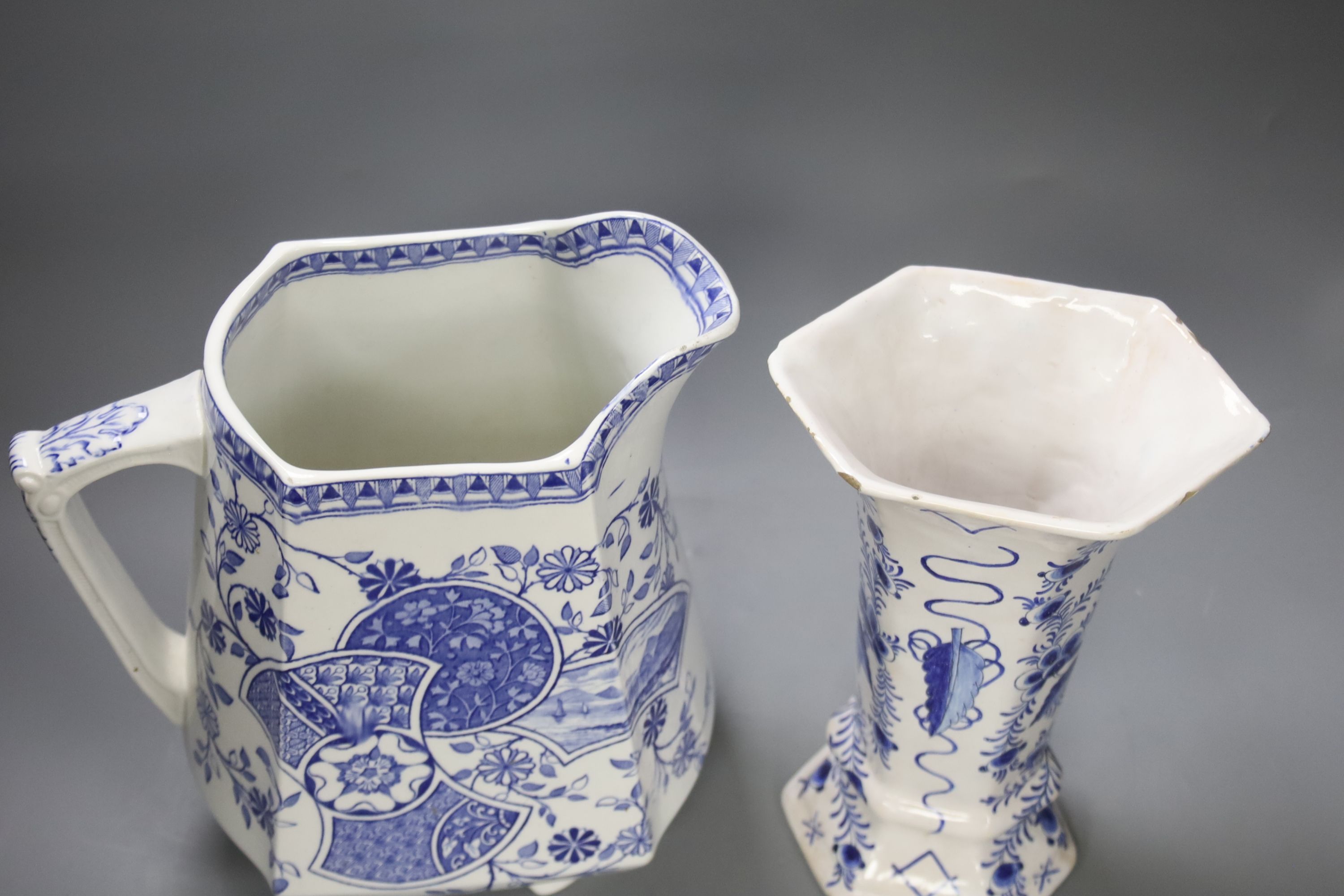 A Blenheim patterned blue and white jug and a Delft vase, tallest 29cm